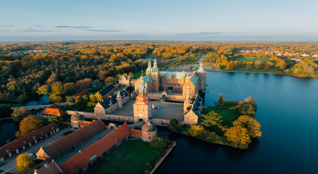 Frederiksborg Castle seen from above in beautiful autumn colors.