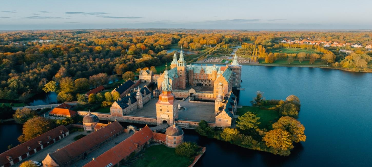 Frederiksborg Castle seen from above in beautiful autumn colors.