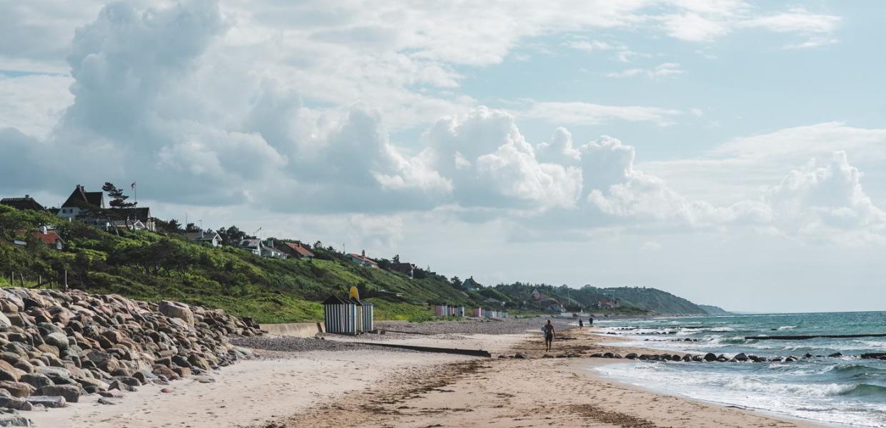 Blue sky and cumulus clouds at Rågeleje Beach in North Zealand, Denmark.