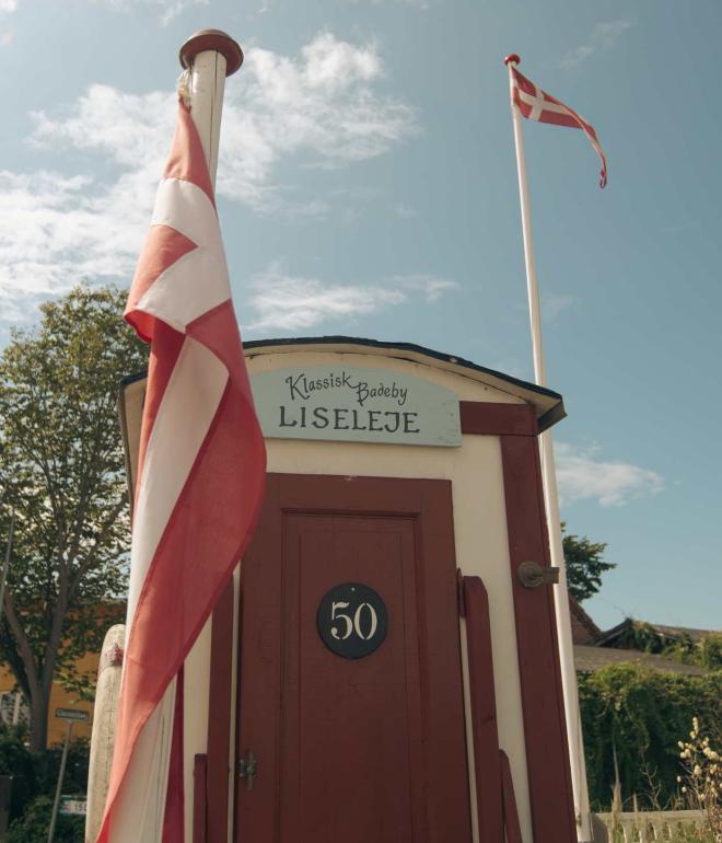 An old bathhouse stands in the sun in Liseleje, North Zealand, Denmark.