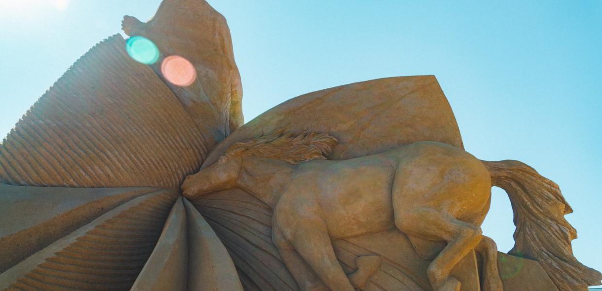 A horse floats away in this sand sculpture in Hundested Sand Sculpture Park.